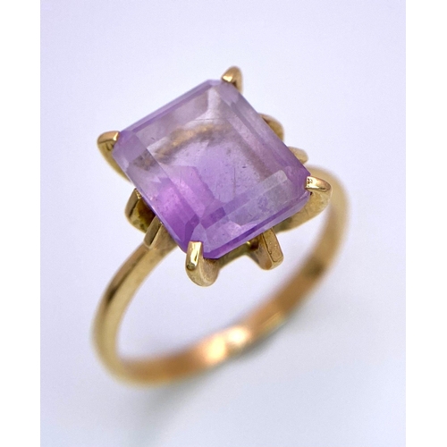 298 - A 14K Yellow Gold (tested) Amethyst Ring. Rectangular cut central amethyst. Size P. 3.52g total weig... 