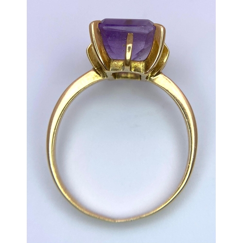 298 - A 14K Yellow Gold (tested) Amethyst Ring. Rectangular cut central amethyst. Size P. 3.52g total weig... 
