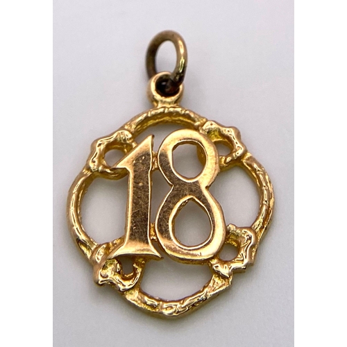 332 - A Vintage 9K Yellow Gold '18' Pendant. 2.5cm. 1.14g weight.