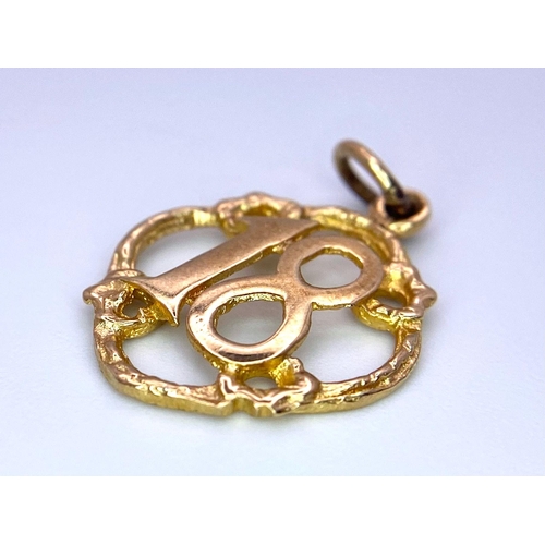 332 - A Vintage 9K Yellow Gold '18' Pendant. 2.5cm. 1.14g weight.