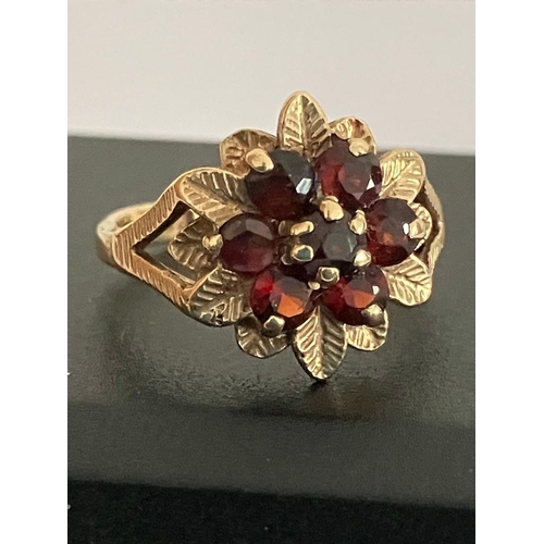 35 - Vintage 9 carat GOLD RING Set to top with GARNETS and GOLD LEAVES  in floral formation. Full UK hall... 