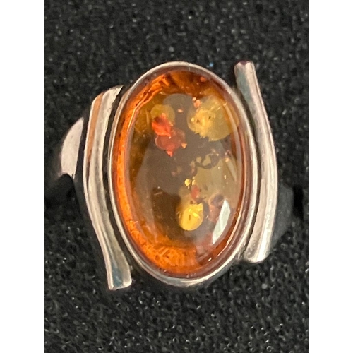 378 - Vintage AMBER CABOCHON RING Having a large oval Amber set in SILVER. Presented in a ring box. Size M... 