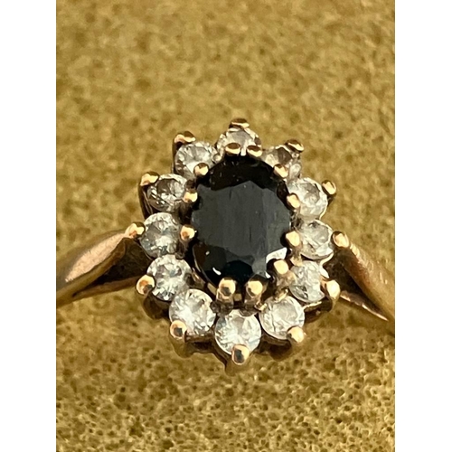 427 - 9 carat GOLD and SAPPHIRE RING. Oval cut with clear white gemstone surround. Full UK hallmark. Prese... 