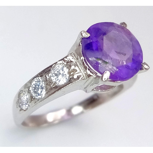 1781 - An Amethyst and White Stone 925 Silver Ring. Amethyst -3ct. 4g total weight. Size M. Comes with a pr... 