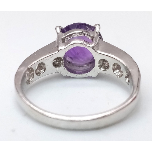 1781 - An Amethyst and White Stone 925 Silver Ring. Amethyst -3ct. 4g total weight. Size M. Comes with a pr... 