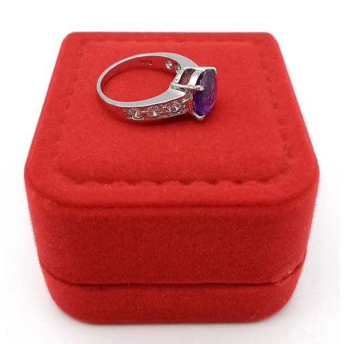 1781 - An Amethyst and White Stone 925 Silver Ring. Amethyst -3ct. 4g total weight. Size M. Comes with a pr... 