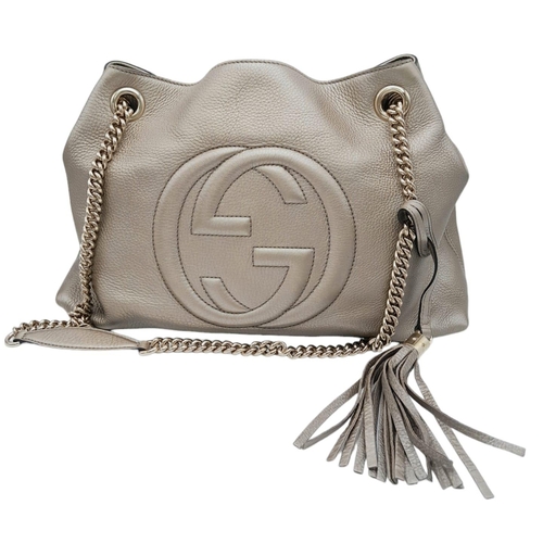 145 - Gucci Soho Shoulder Bag.
Grained champagne leather with Silver toned hardware. Two chain-link should... 