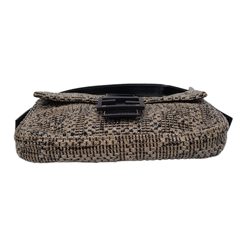 241 - Fendi Woven Baguette Bag.
Quality top handle with silver toned hardware. textured woven material ext... 