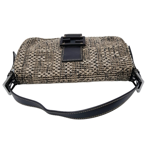 241 - Fendi Woven Baguette Bag.
Quality top handle with silver toned hardware. textured woven material ext... 