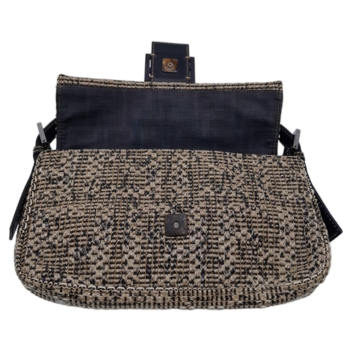 241 - Fendi Woven Baguette Bag.
Quality top handle with silver toned hardware. textured woven material ext... 