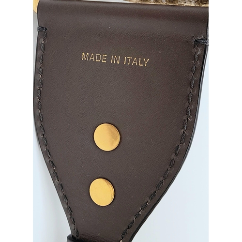 68 - Christian Dior Saddle Handbag.
Brown monogrammed velvet bag with gold tone hardware. Additional, rem... 