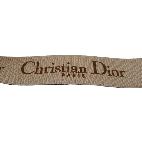 68 - Christian Dior Saddle Handbag.
Brown monogrammed velvet bag with gold tone hardware. Additional, rem... 