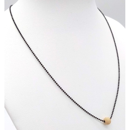 1795 - Black Sterling Silver Necklace with Golden Bead pendant.
40cm in length.
Weight: 2.12g