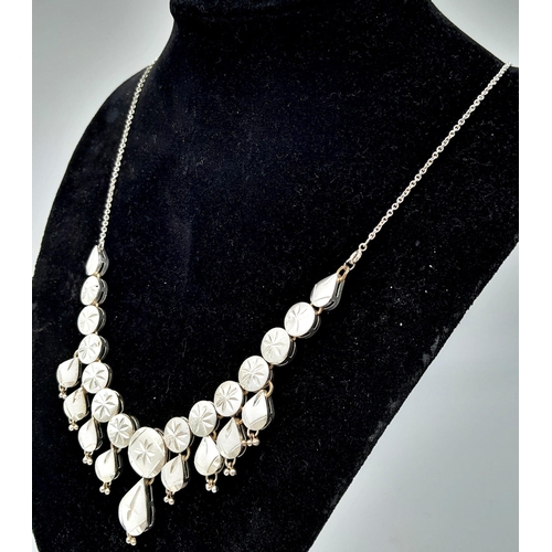 753 - A Unique Vintage or Antique Cased Silver Necklace and Matching Earring Set. 
60cm Length Detailed De... 