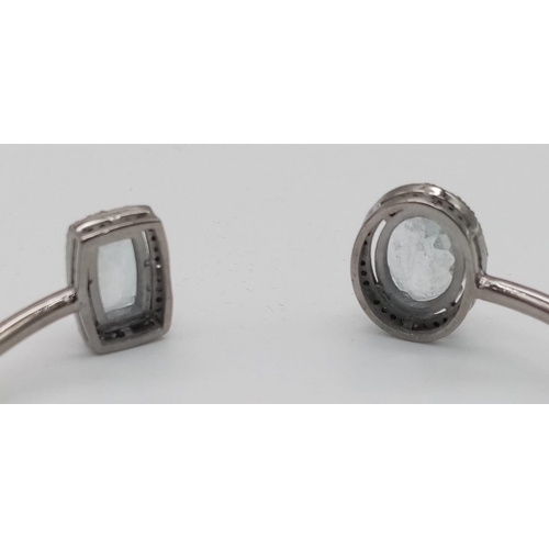 137 - An Aquamarine Cuff Bangle with Rose-Cut Diamond Halos. Set in 925 Sterling silver. Aquamarine - 8.75... 