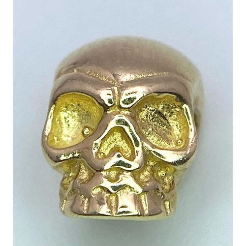 776 - A 14K YELLOW GOLD SKULL PENDANT. 1.6G