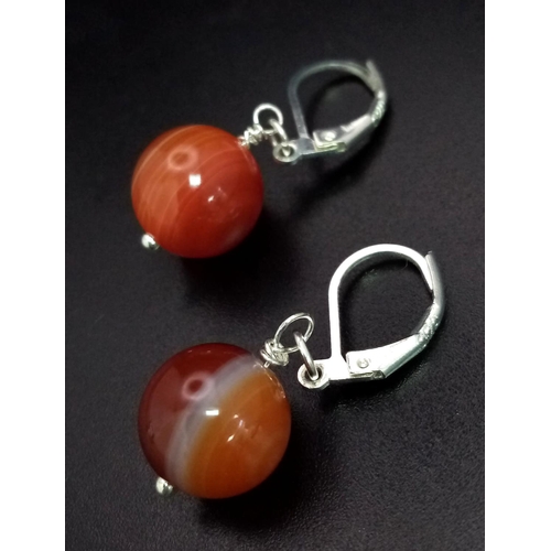 1731 - Pair of Orange Agate hanging ball earrings.

Earring fixing is 925 Sterling Silver.