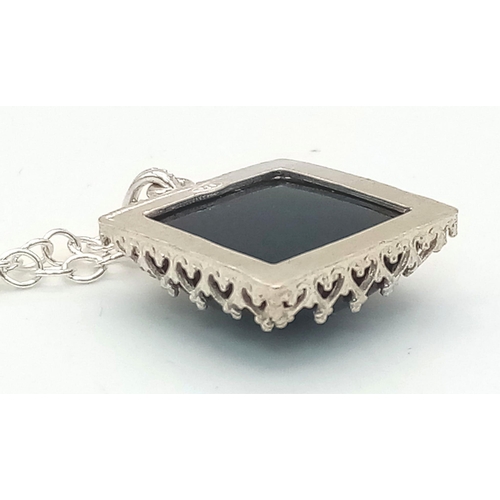 1456 - A SQUARE BLACK ONYX PENDANT ON A 42cms SILVER CHAIN .  5.9cms .