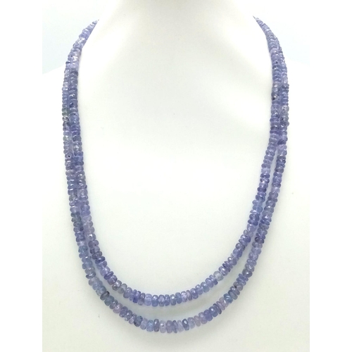 1078 - A Two Row Tanzanite Gemstone Necklace with an Emerald and 925 Silver Clasp. 45cm in length, 175ctw t... 