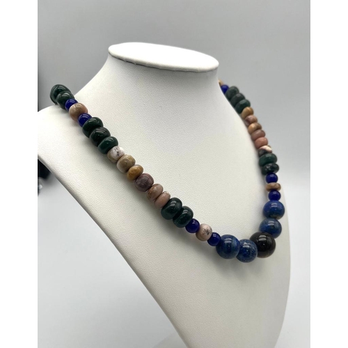 1610 - A Tigers Eye, Jade and Lapis Lazuli Necklace. A mixture of rondelle and round beads. Largest central... 