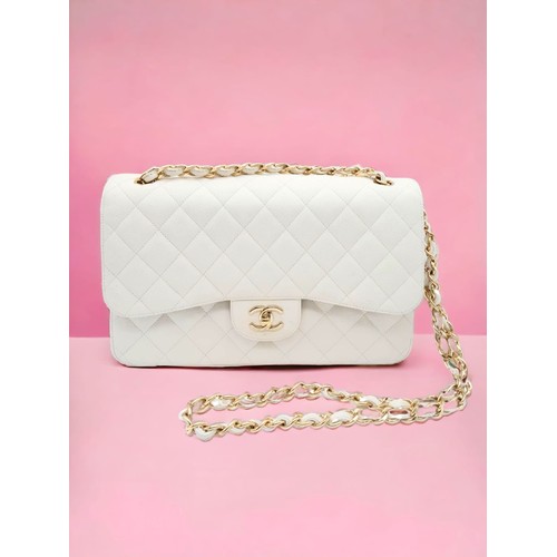 2 - Chanel Caviar Jumbo Single Flap Bag.
Quilted white caviar leather stitched in diamond pattern. Gold ... 