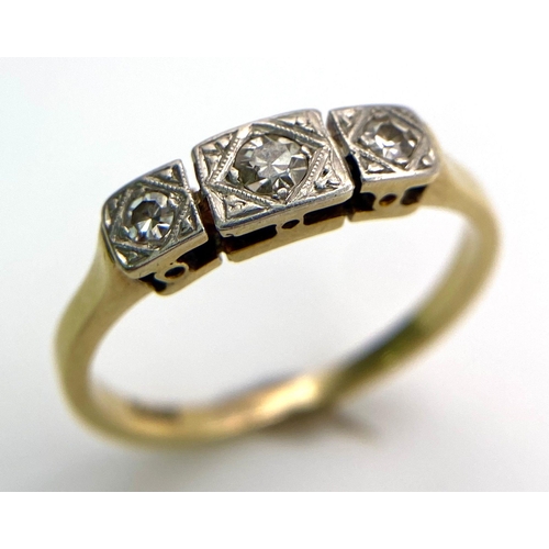 1526 - A 18kt Yellow Gold Ring with Trio of Diamonds.
Each of the three Diamonds are mounted and framed bea... 