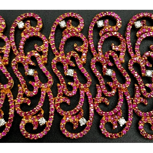 1547 - An 18K Rose Gold Ruby and Diamond Statement Bracelet. Interlocking ruby encrusted seahorse links wit... 