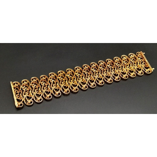 1547 - An 18K Rose Gold Ruby and Diamond Statement Bracelet. Interlocking ruby encrusted seahorse links wit... 