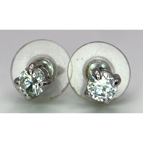 1561 - A Pair of White CZ Stone Stud Earrings.