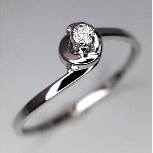 1338 - An 18K White Gold Diamond Solitaire Ring. Size N. 1.15g total weight. Brilliant round cut diamond.