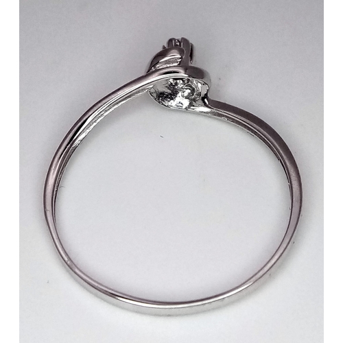 1338 - An 18K White Gold Diamond Solitaire Ring. Size N. 1.15g total weight. Brilliant round cut diamond.