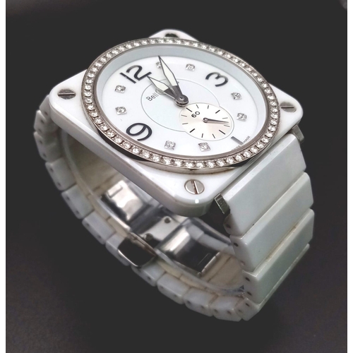 1345 - A Bell and Ross Quartz Ladies Watch. Ceramic and stainless steel bracelet and case - 40mm. White dia... 