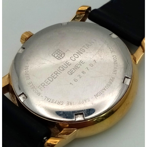 1359 - A Frederique Constant Geneve Moon Phase Watch. Black leather strap. Gilded case - 40mm. White dial w... 