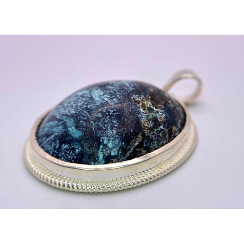 1013 - A Natural Turquoise Cabochon 925 Silver Pendant. Turquoise- 68.60 ct. Total Weight - 21g. Comes with... 