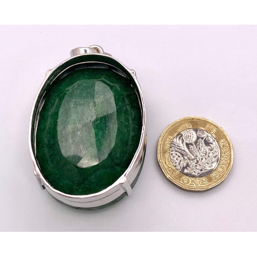 1041 - A 275ct Oval Shape Emerald Pendant! Set in 925 Silver. 65g total weight. Comes with a presentation c... 