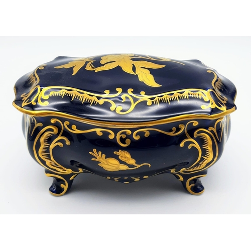 1351 - A NICELY DECORATED KOBALT TRINKET BOX. 17 X 10cms and 12cms in height