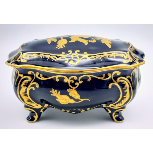 1351 - A NICELY DECORATED KOBALT TRINKET BOX. 17 X 10cms and 12cms in height