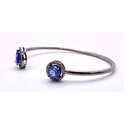 1426 - A Tanzanite and Diamond 925 Silver Cuff Bangle. Tanzanite - 4ctw. Diamonds - 0.50ctw. 11.83g total w... 