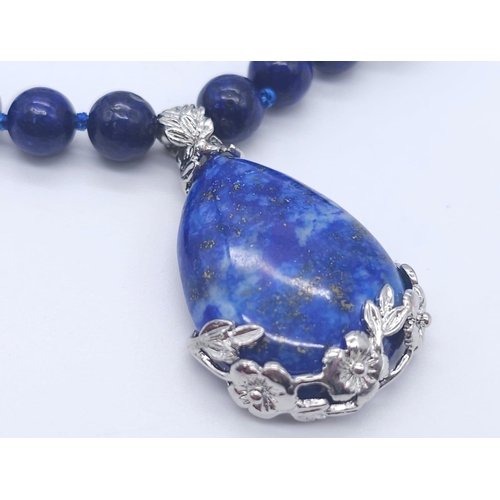 1575 - A Lapis Lazuli Suite Comprising of Necklace with Drop Pendant - 42cm and 4cm. Decorative oval lapis ... 