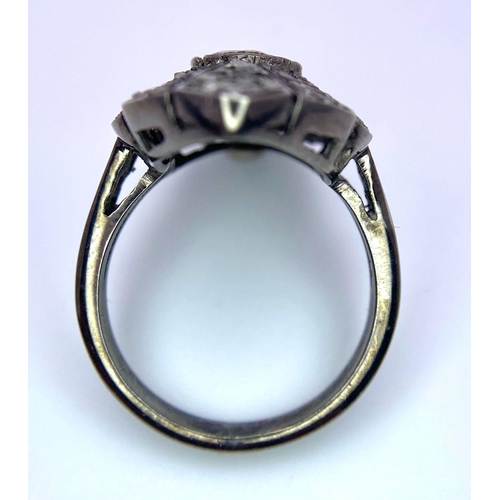 168 - An Edwardian, ART NOUVEAU sterling silver ring with a large natural untreated diamond surrounded by ... 