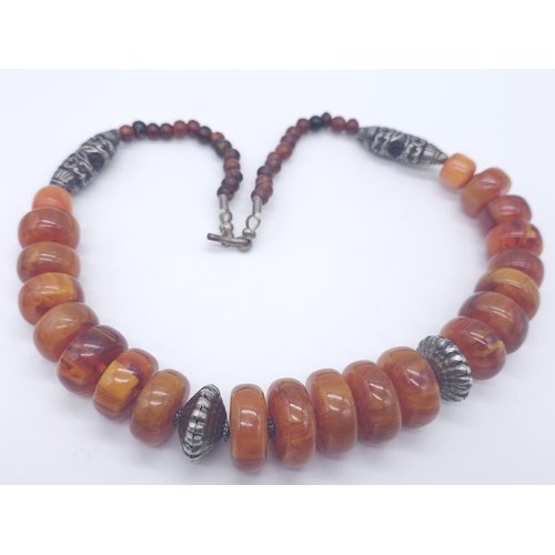 1710 - A Tibetan Style Amber Resin Necklace - With an antique style carnelian cuff bracelet and pendant ear... 