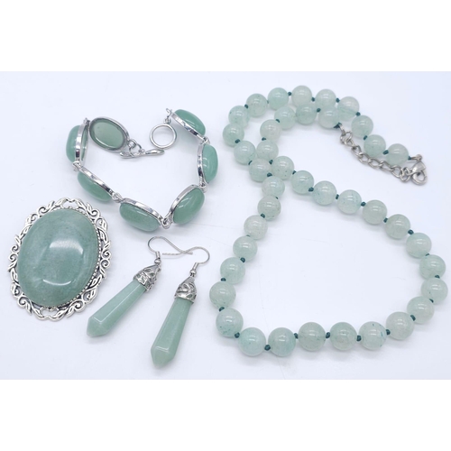 1783 - A Green Jade Jewellery Lot. To include: Bead necklace - 46cm, oval bracelet - 17cm, oval brooch - 5c... 