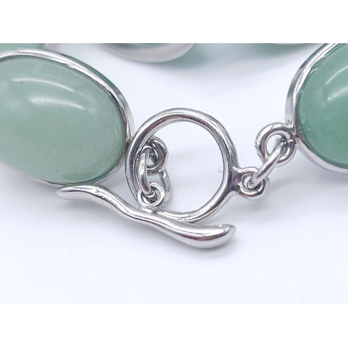 1783 - A Green Jade Jewellery Lot. To include: Bead necklace - 46cm, oval bracelet - 17cm, oval brooch - 5c... 