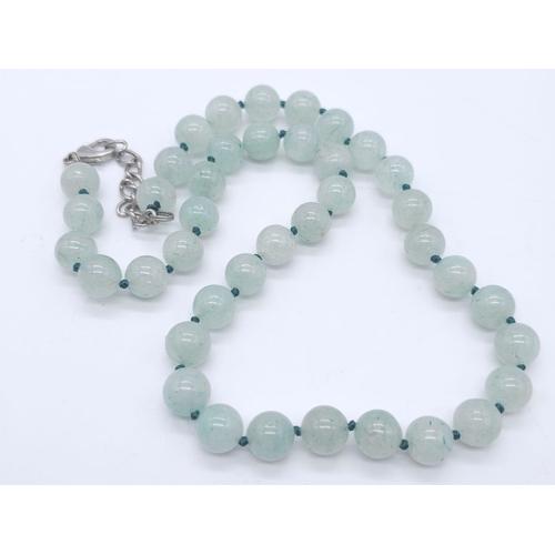 1783 - A Green Jade Jewellery Lot. To include: Bead necklace - 46cm, oval bracelet - 17cm, oval brooch - 5c... 