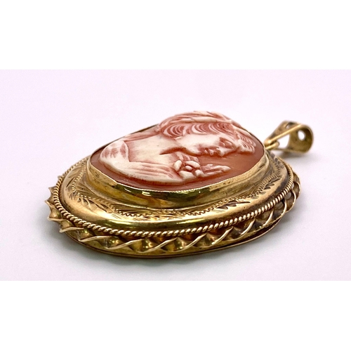 197 - A Vintage 9K Yellow Gold Cameo Pendant. Oval cameo amidst ornate and engraved gold. 5.5cm. 16.55g to... 