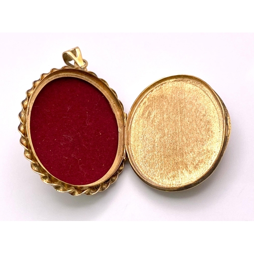 197 - A Vintage 9K Yellow Gold Cameo Pendant. Oval cameo amidst ornate and engraved gold. 5.5cm. 16.55g to... 