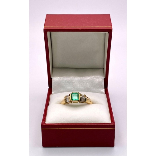 236 - A fabulous 14K Yellow Gold Ring with a stunning Cushion-Cut Emerald flanked by baguette Diamonds.
Co... 