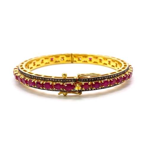 309 - A Sophisticated Ruby and Diamond Gemstone Bangle/Bracelet. Clip-open style with approx 3.5ctw of Dia... 