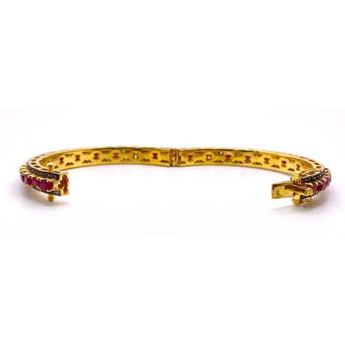 309 - A Sophisticated Ruby and Diamond Gemstone Bangle/Bracelet. Clip-open style with approx 3.5ctw of Dia... 