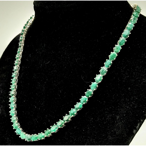 34 - An Emerald Gemstone Tennis Necklace set in 925 Silver. 47cm length. 40g total weight.